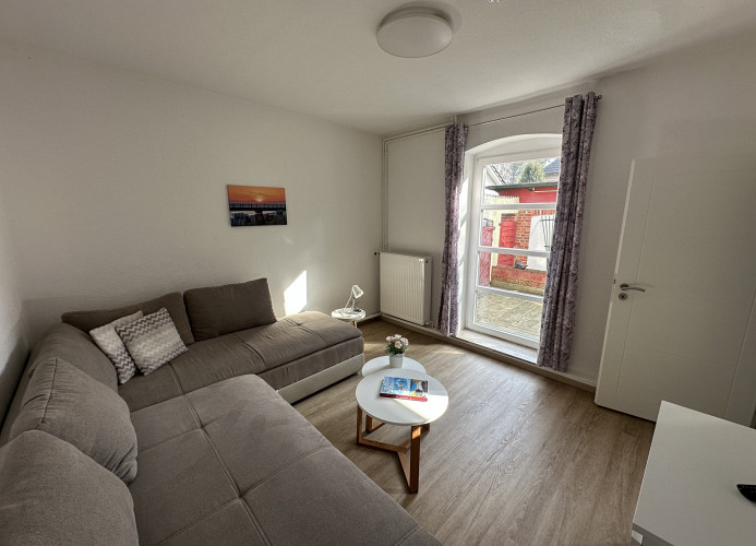 Wohnzimmer mit Zugang zur Terrasse